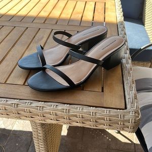 These are brand new women’s thin two strap heeled slide sandal.
